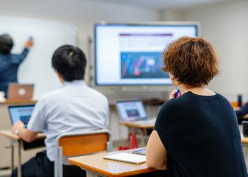 Mid adult woman in a continuing education class at a community college or university
